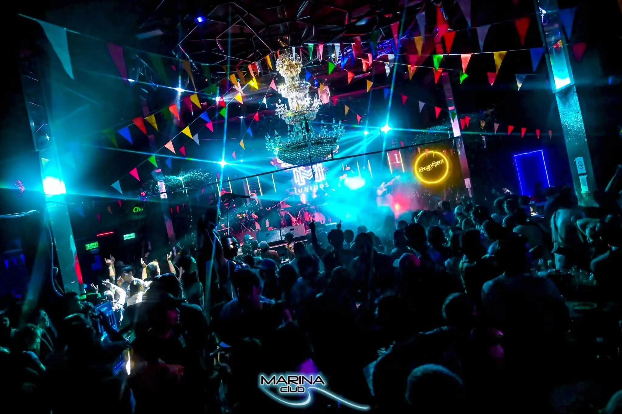 Marina Club, a nightclub near the hotel, lit up and full of dancing guests