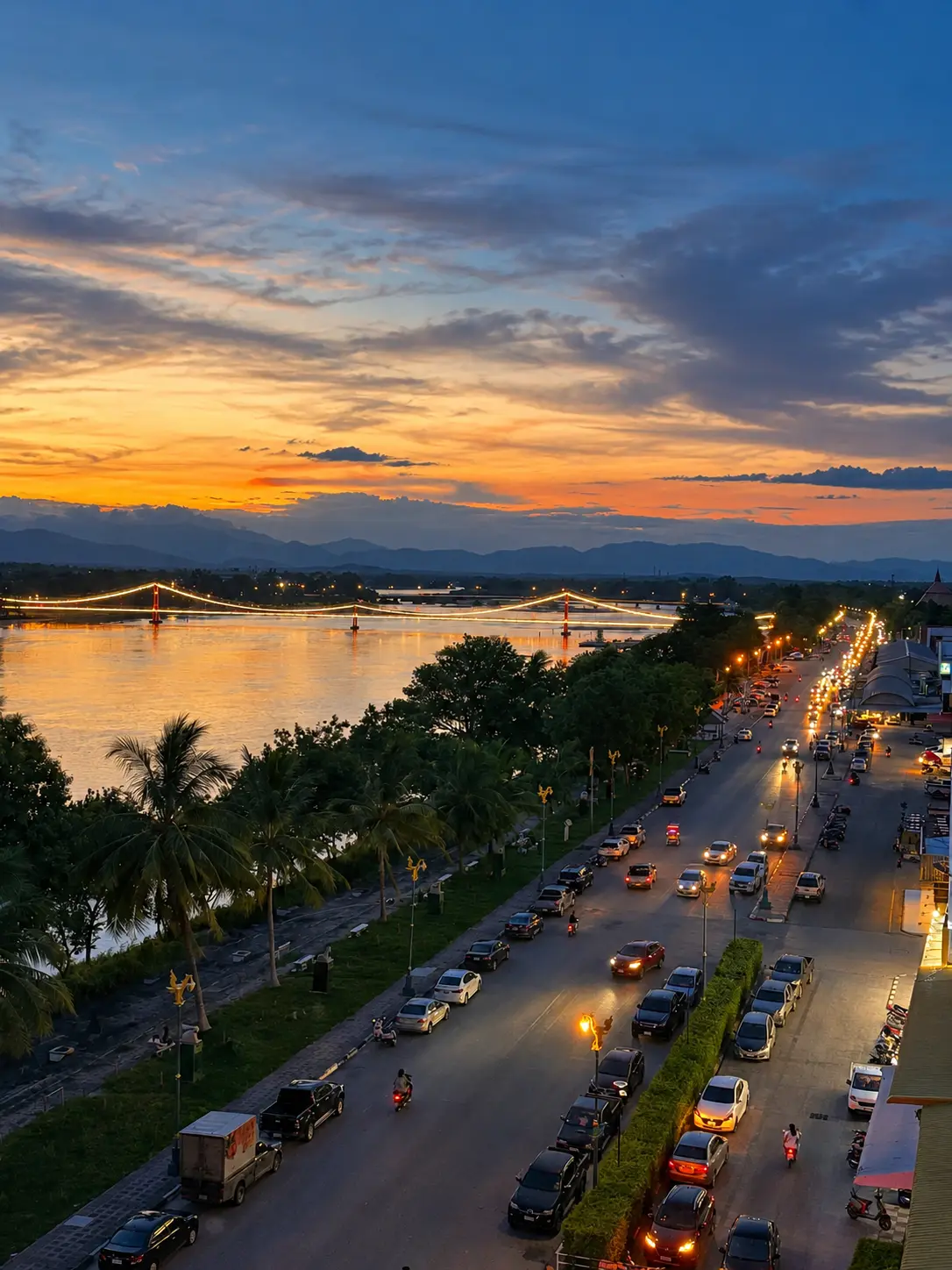 Sunset over the Ping River, seen from a hotel room balcony