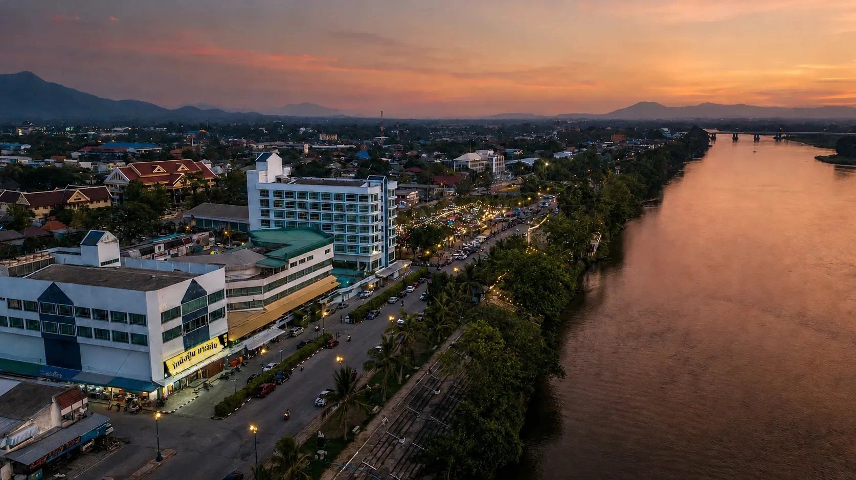 Aerial view of The Viang Tak Riverside Hotel on the Ping River at sunset
